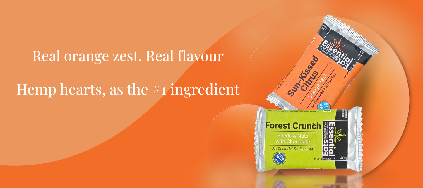 Two energy bars on an orange background with text about ingredients.