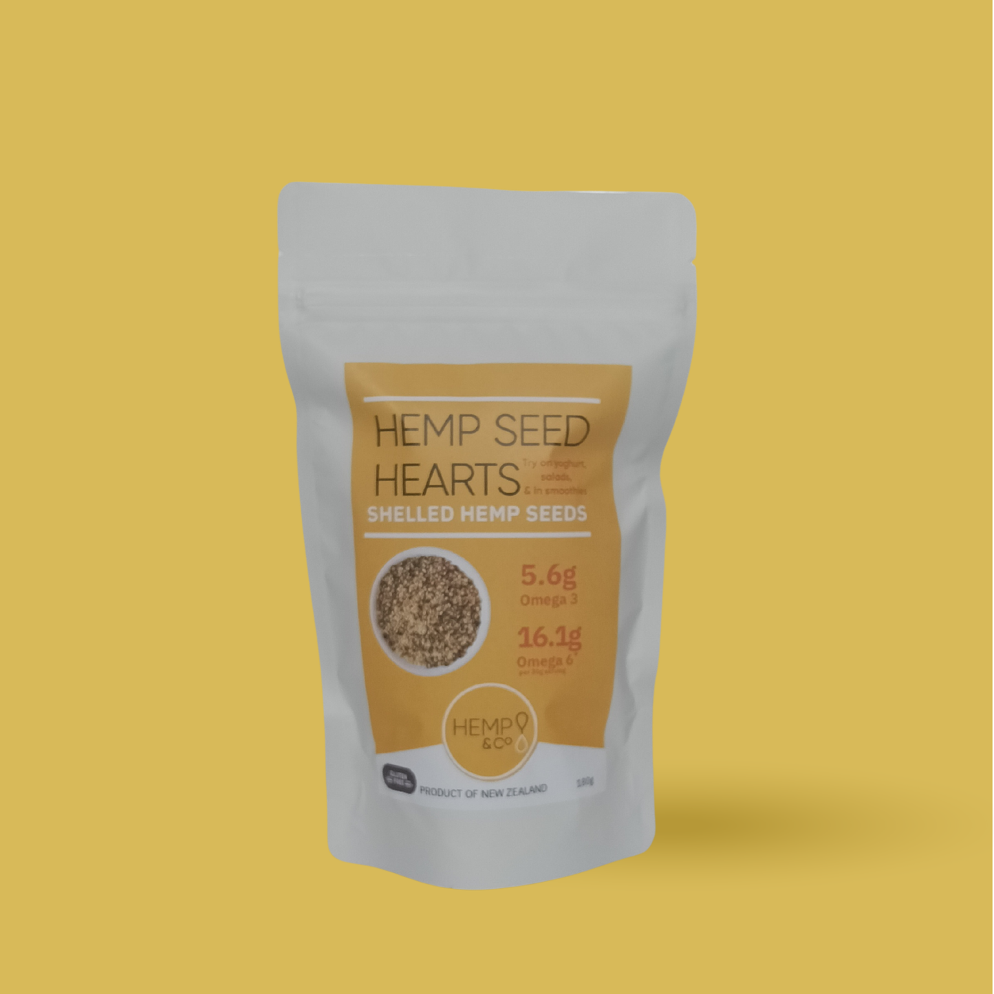Package of Hemp Seed Hearts 180g on a yellow background