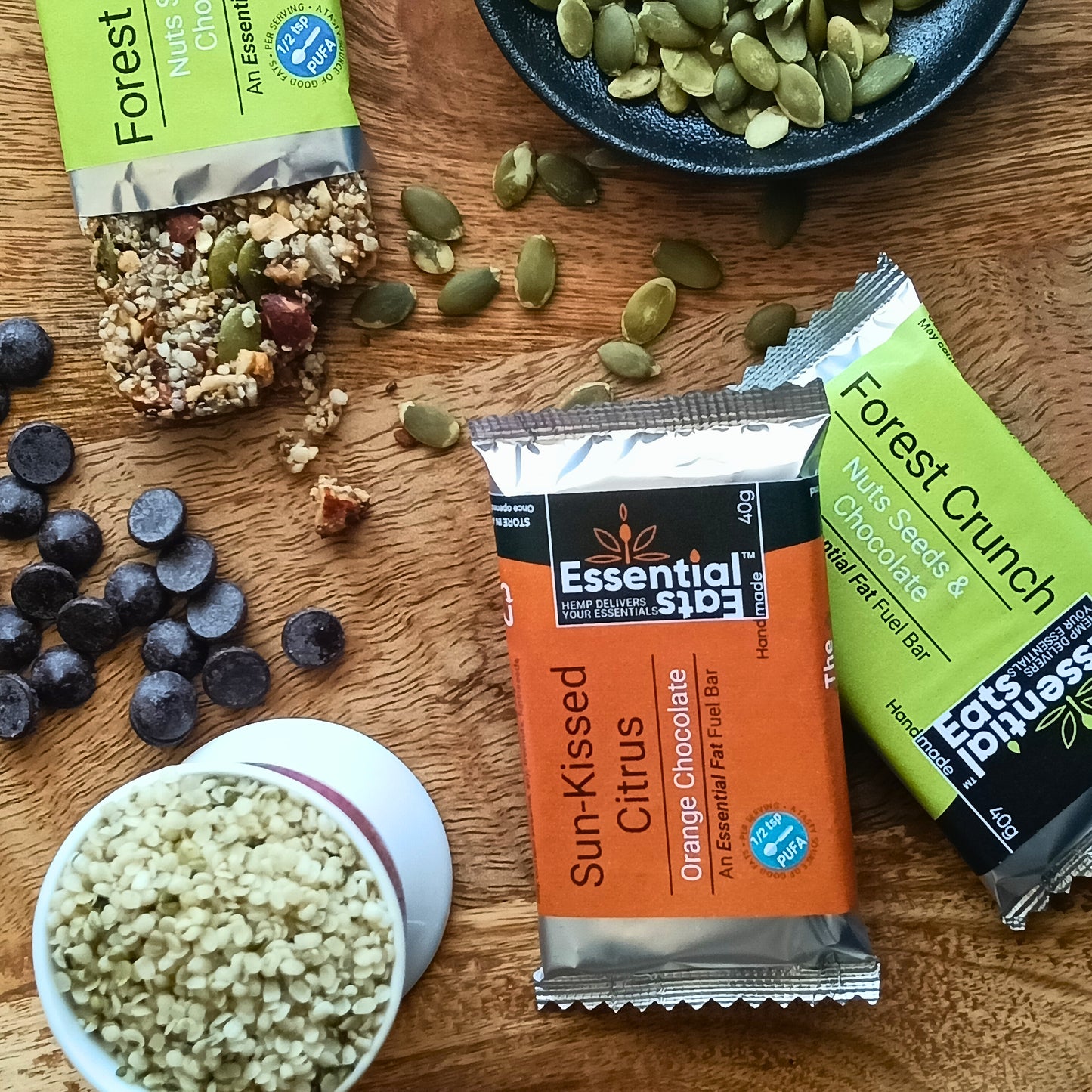 Essential Eats bars with ingredients on a wooden surface
